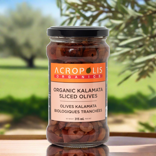 Jar of Acropolis Organics Organic Kalamata Sliced Olives which are traditionally fermented in a brine of sea salt, local spring water, and vinegar.  Our kalamata olives are harvested from family orchards in Southern Peloponnese, Greece. Free of caustic sodas & dyes.  Eat Olives. For the Health of it! Buy Online Today!